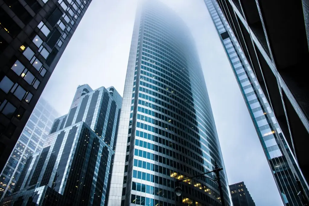 Tall, glass-covered skyscrapers disappearing into the clouds, symbolising the growth and ambition Rebellion Websites brings to businesses online